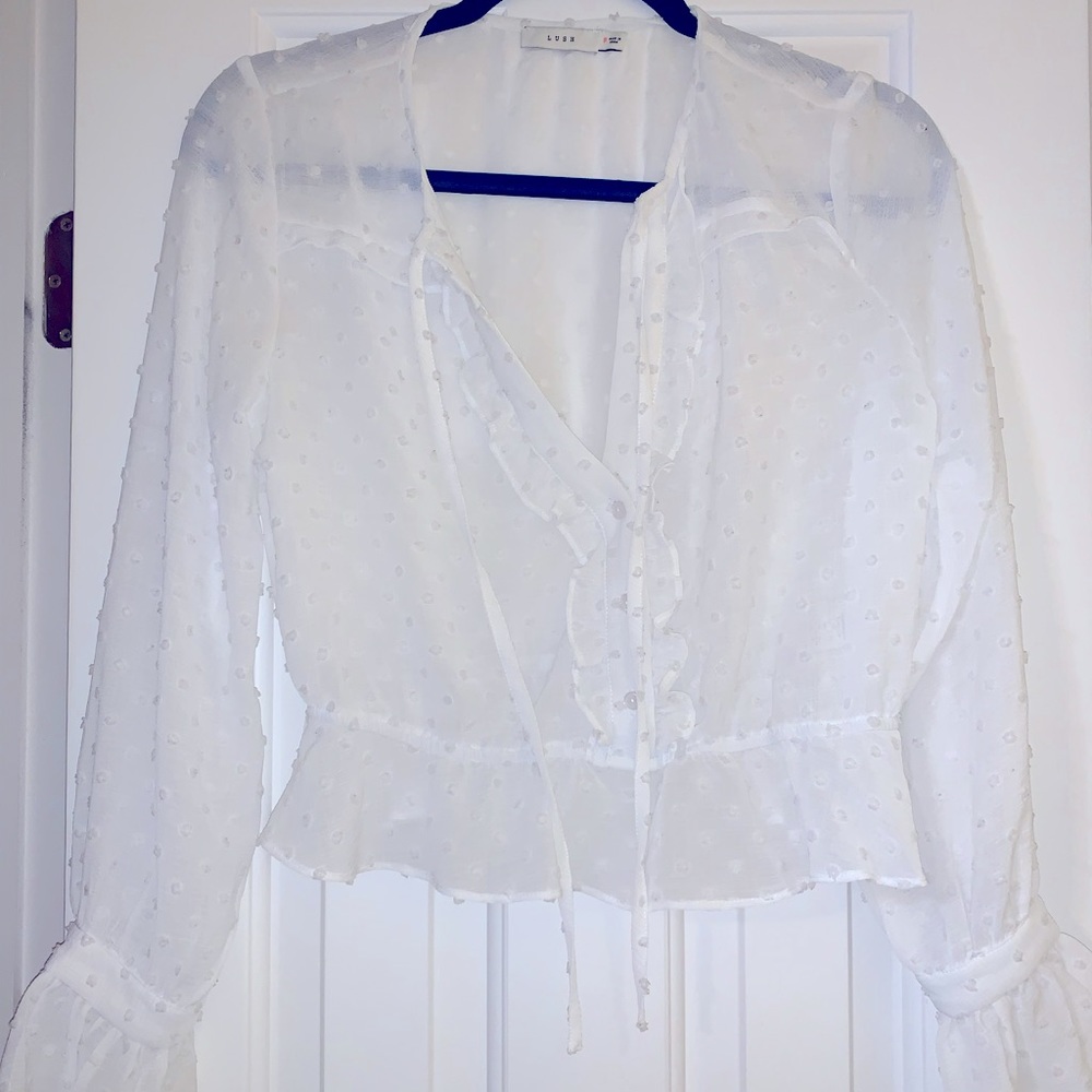 Lush sheer white blouse with ruffled peplum